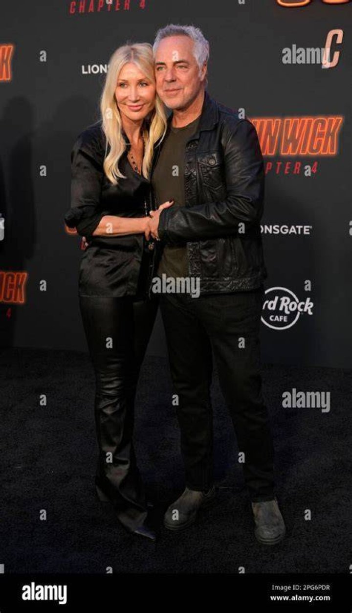 Titus Welliver and his wife Jose Stemkens pose together at the premiere